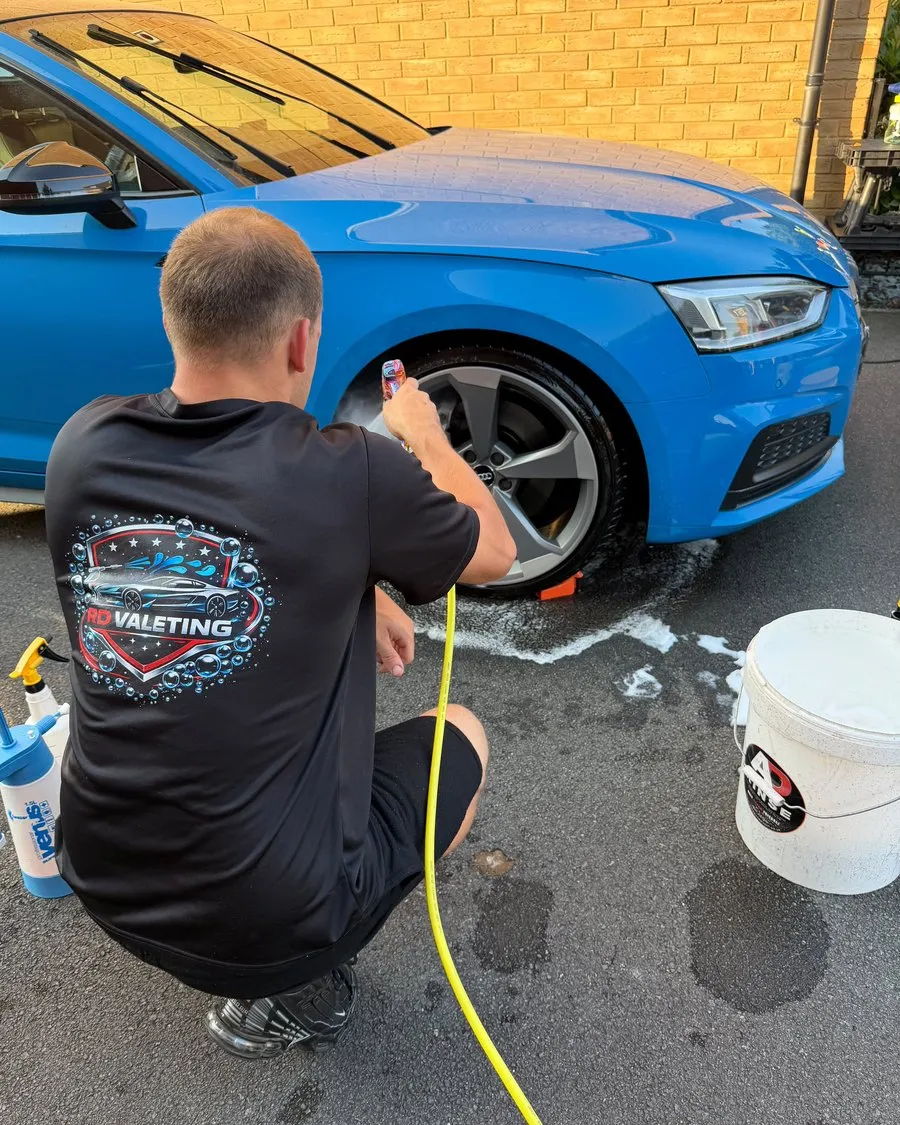 Rhys of RD Valeting rinsing the wheels of an Audi S5 in Swindon