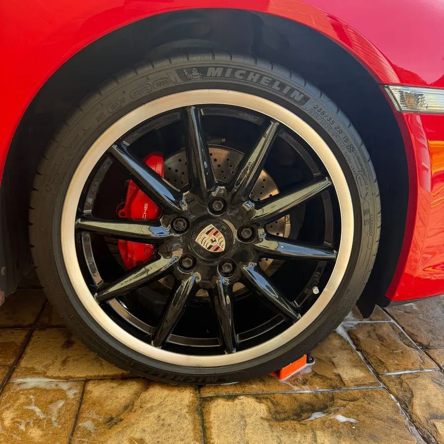 Alloy wheel and red brake caliper cleaned by RD Valeting