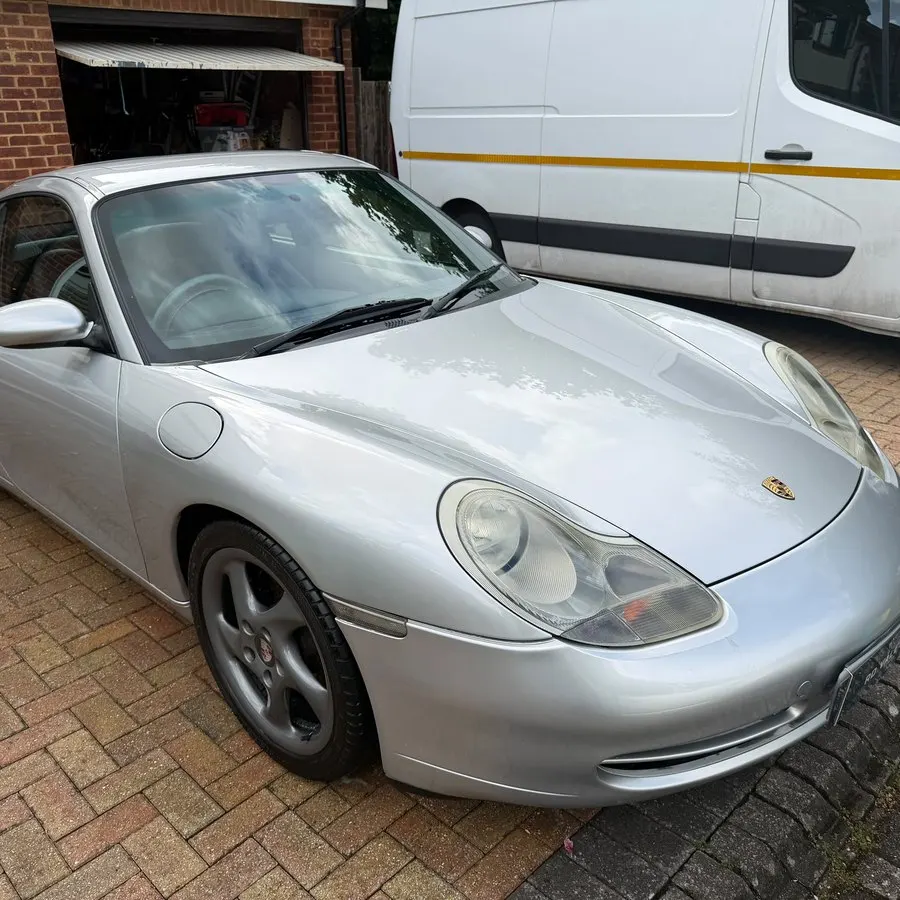 Silver Porsche 911 valeted on a driveway in Wiltshire